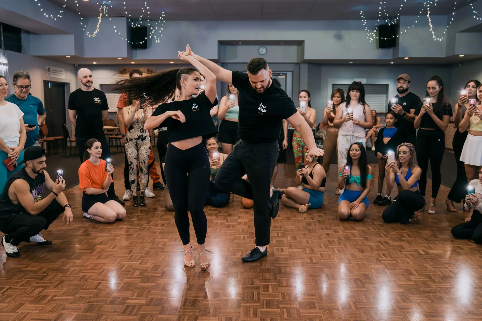 Alex and Madalyn dancing as the class watches