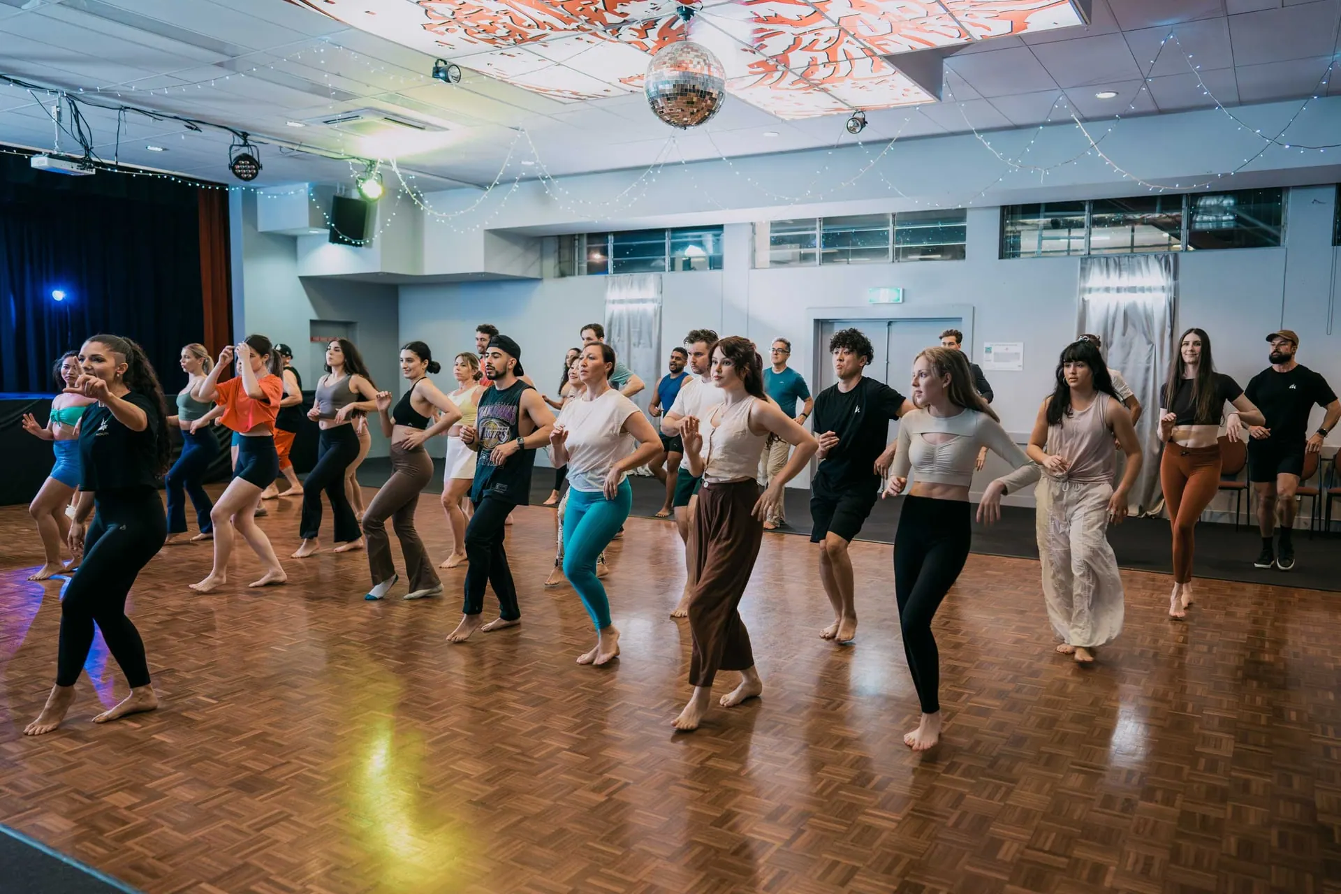 A full shines class learning footwork together