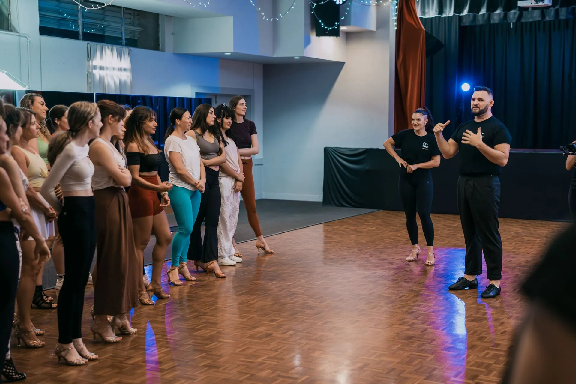 LocoMojo instructors talking a class through the next move